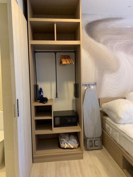 Bedroom with built-in closet and bed