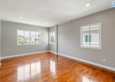 Spacious main living area with wooden flooring and natural light