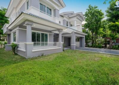 Exterior view of a suburban house with a front yard