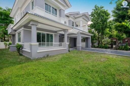 Exterior view of a suburban house with a front yard