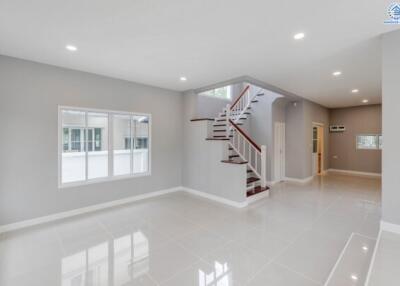 Spacious modern living room with staircase