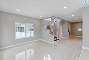 Spacious modern living room with staircase