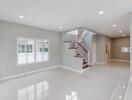 Spacious modern living room with staircase