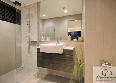 Modern bathroom with glass shower enclosure and elegant fixtures