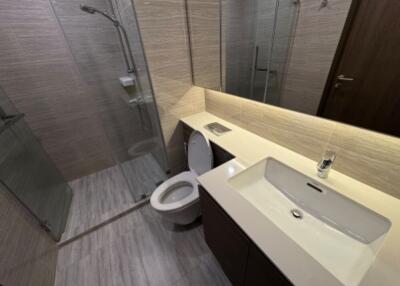 Modern bathroom with shower, toilet, and sink