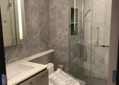 Modern bathroom with glass shower and bidet