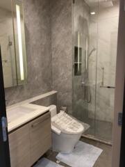 Modern bathroom with glass shower and bidet