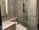 Modern bathroom with glass shower and bidet