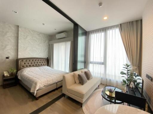 Modern bedroom with large windows and comfortable bed