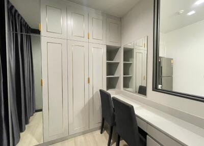 Bedroom with vanity and closet