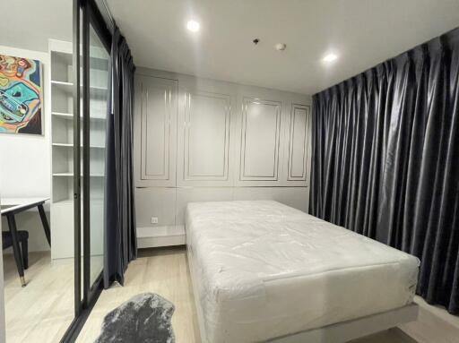 Modern bedroom with bed and study corner