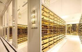 Luxurious wine cellar with gold racks and ambient lighting