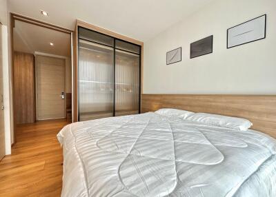 Spacious bedroom with double bed and built-in wardrobe.