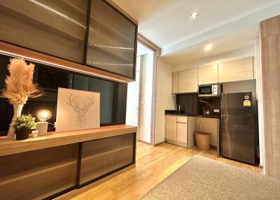 Modern kitchen with stainless steel appliances and wooden cabinets