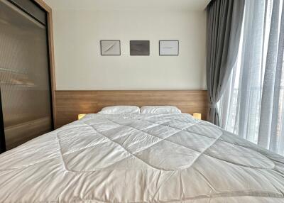 neatly made bed in a modern bedroom