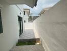 Outdoor corridor leading to modern home