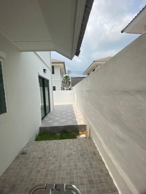 Outdoor corridor leading to modern home