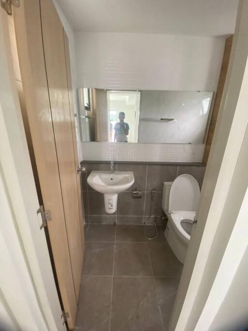 modern bathroom with tiles and a large mirror