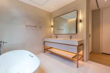 Modern bathroom with double sink and bathtub