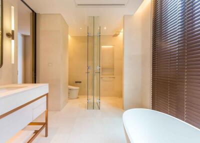 Modern bathroom with glass shower and freestanding bathtub