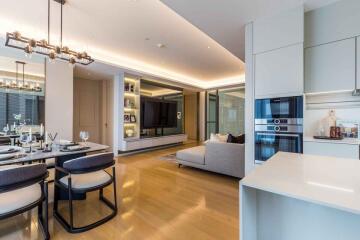 Modern open-plan living area with dining and kitchen