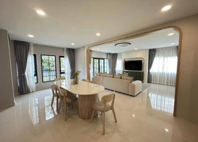 Spacious open plan living and dining area with modern furnishings