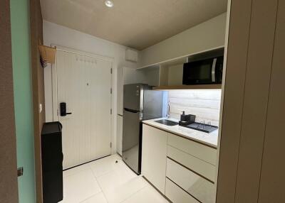 Modern kitchen with white cabinets and stainless steel appliances