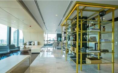 Modern living room with yellow shelving and city view