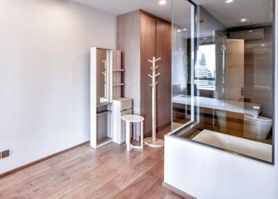 Modern bedroom with wooden flooring and built-in wardrobe