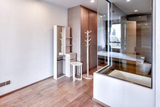 Modern bedroom with wooden flooring and built-in wardrobe