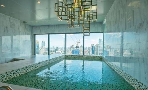 Indoor swimming pool with city view