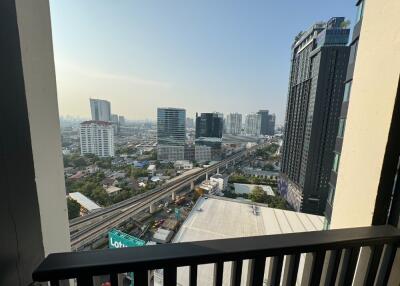 View from balcony overlooking city skyline