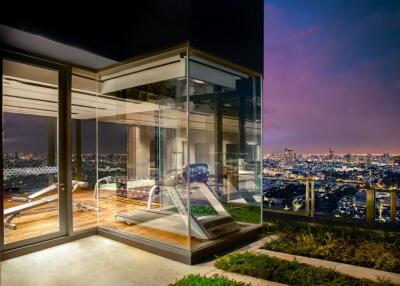 Rooftop gym with city views at night