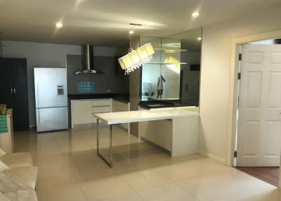 modern kitchen with reflective surfaces and ample lighting