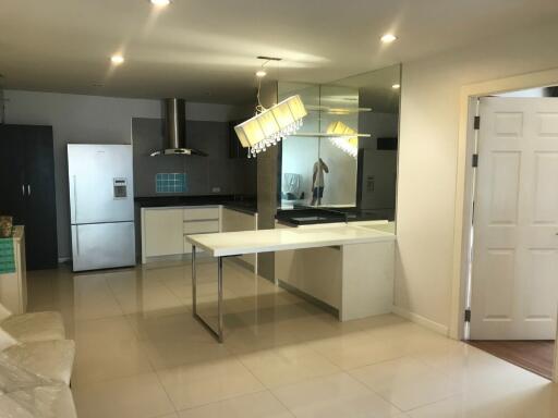 modern kitchen with reflective surfaces and ample lighting