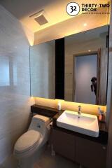 Modern bathroom with large mirror and sink