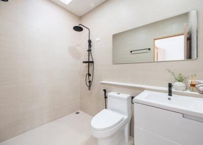 Modern bathroom with shower and white fixtures