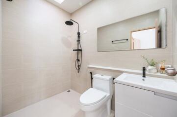 Modern bathroom with shower and white fixtures