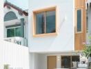 Facade of a modern house with a small vintage car parked outside