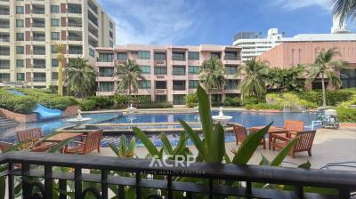 Exterior view of residential buildings with pool and outdoor seating