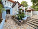 Outdoor pool area with tiled flooring, stairs, and pavilion