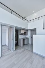 Modern kitchen with adjacent balcony and bathroom