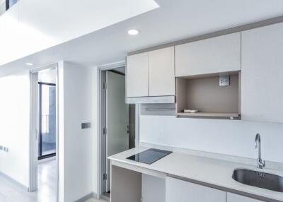 Modern kitchen with white cabinets and countertops