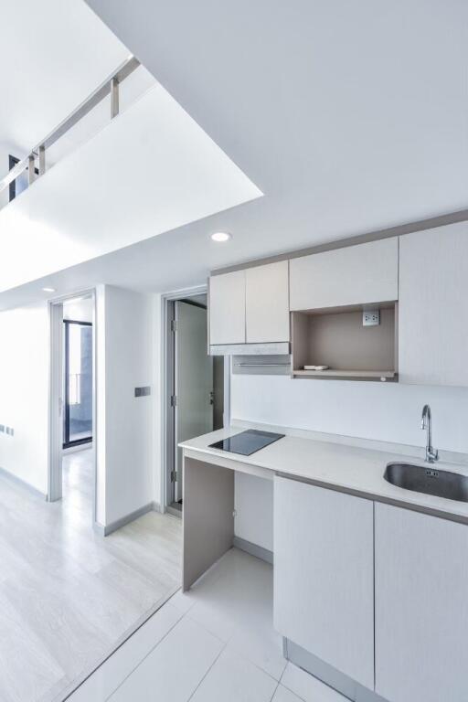 Modern kitchen with white cabinets and countertops