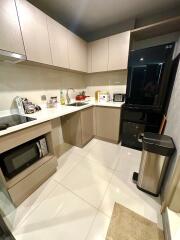 Modern kitchen with appliances and sleek cabinetry