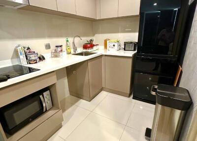 Modern kitchen with built-in appliances and sleek cabinetry