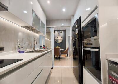 Modern kitchen with appliances and adjacent dining area