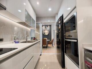 Modern kitchen with appliances and adjacent dining area