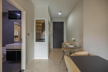 Apartment hallway with a small dining area