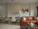 living room with brown leather sofa, dining area, and modern decor